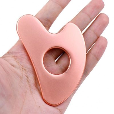 Edelstahl Herzförmige Hohl Gua Sha Board Metall Gesichtsschönheitsmittel für Ganzkörpermassage und OEM / ODM
