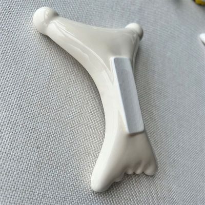 OEM/ODM X-förmige Keramik Gua Sha Scraping Massager Schönheitssalon unerlässlich für Gesichtsentspannung