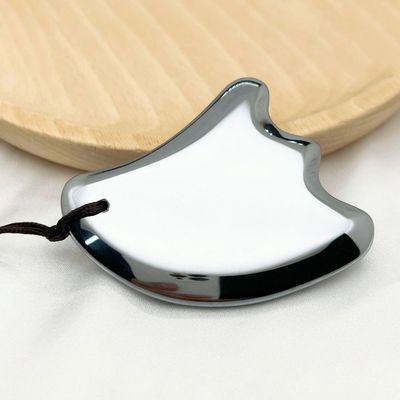 Gesichtsmassager Flügelform Terahertz Schabplatte Körpermassage Ausrüstung für Gesichtslift Massagebrett