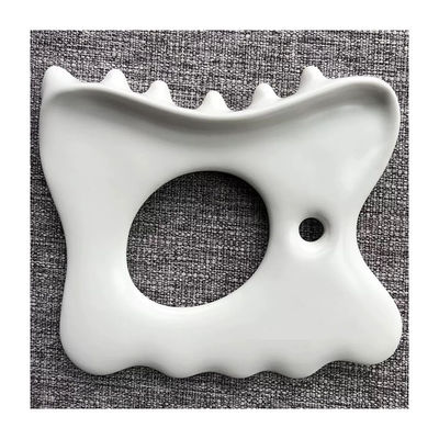 Linderung von Muskelbelastung und Schmerzen mit kundenspezifischem Logo Keramik Gua Sha Werkzeug Kiefer Massage