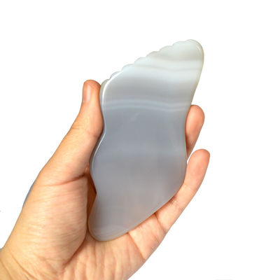 Graue Achat Guasha Massagebrett für die persönliche Gesundheitsversorgung und Lymphdrainage