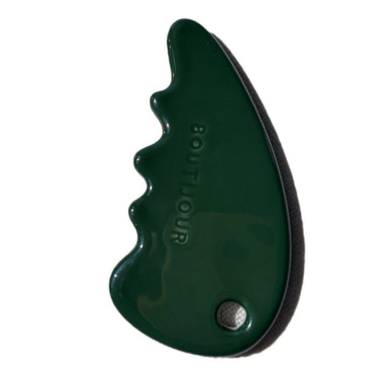 Gesichtsmassager Gua Sha Stein in grüner Farbe für Selbstpflege und Schönheitssalon